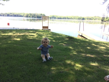 Our daughter next to the lake